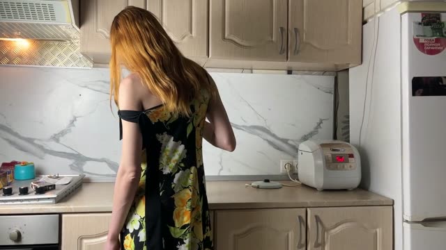 Redhead gives nasty morning blowjob in kitchen