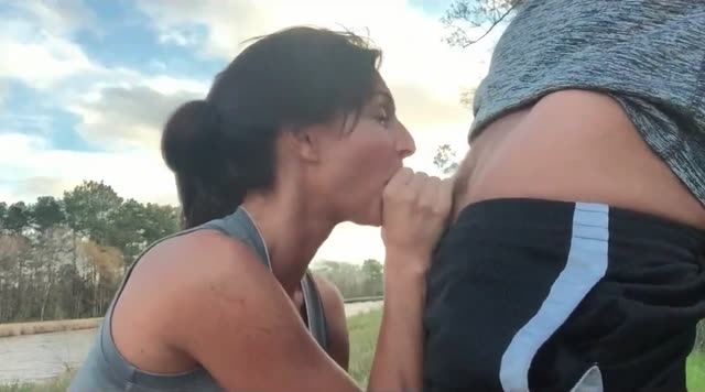 Sexy milf swallows on public nature walk