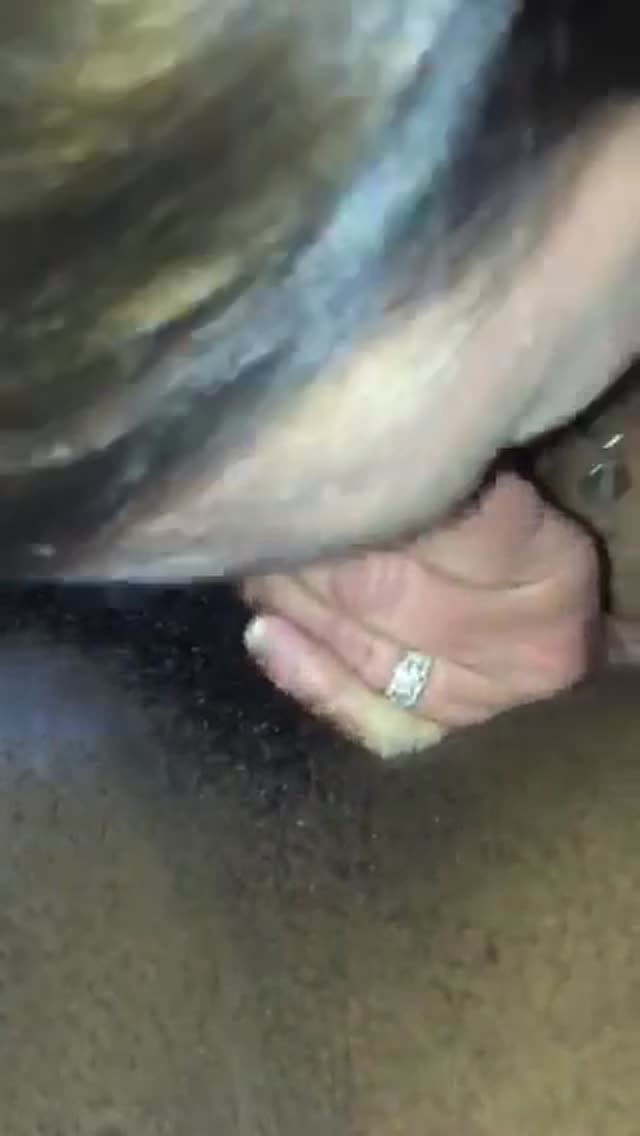 Wife shows wedding ring while sucking black cock