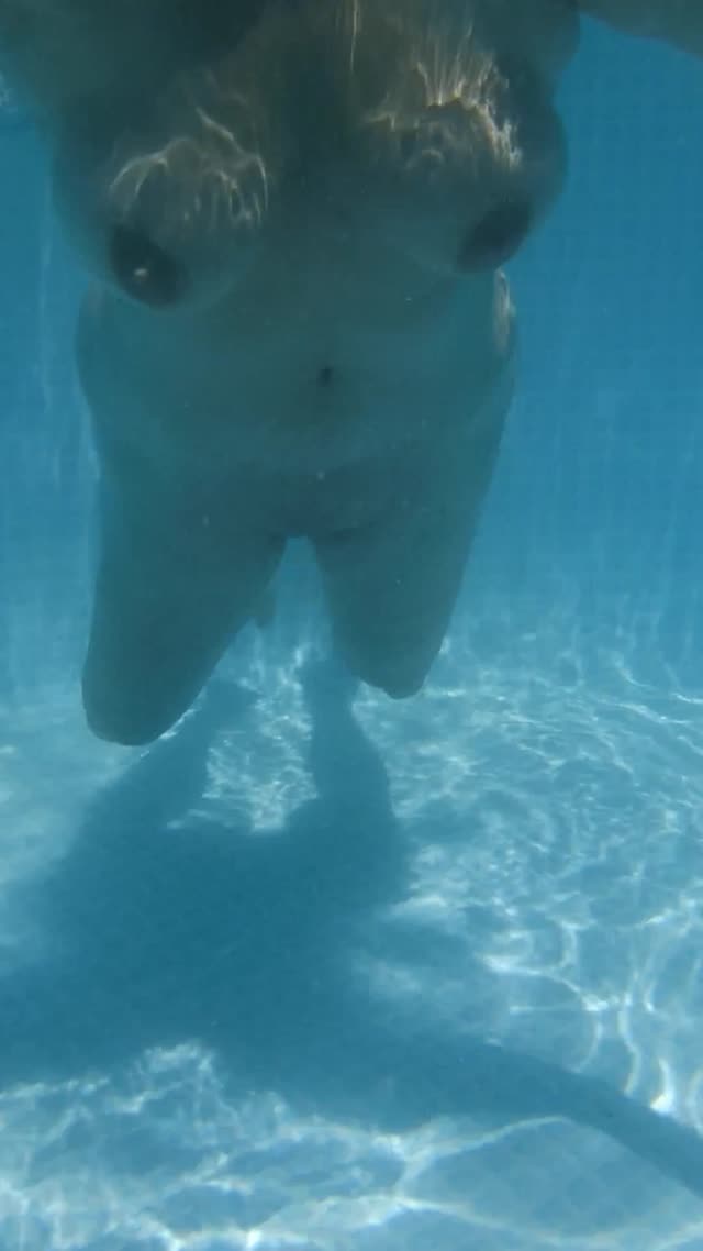 Slut wife swimming nude in a public pool